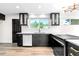 Bright kitchen featuring modern cabinets, stainless steel appliances, and hardwood floors at 220 S Raleigh St, Denver, CO 80219