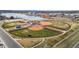 Well-maintained ball fields offer recreational opportunities near a scenic lake and residential community at 6595 Meade Ct, Arvada, CO 80003