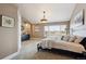 Bedroom features a ceiling fan, carpet floors, and a window with exterior views at 6595 Meade Ct, Arvada, CO 80003