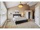 Bedroom features a ceiling fan, carpet floors, closet and large window at 6595 Meade Ct, Arvada, CO 80003