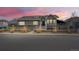 Stunning exterior view of home at dusk featuring mature landscaping and a well-maintained yard at 6595 Meade Ct, Arvada, CO 80003