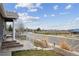 Inviting front porch and entryway with decorative landscaping provide curb appeal at 6595 Meade Ct, Arvada, CO 80003