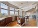 Kitchen area with a view to the living room and great natural lighting at 6595 Meade Ct, Arvada, CO 80003