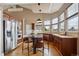 Large kitchen with stainless steel appliances and an island with seating at 6595 Meade Ct, Arvada, CO 80003