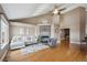 Inviting living room boasts fireplace, vaulted ceilings, and hardwood floors for a cozy gathering space at 6595 Meade Ct, Arvada, CO 80003
