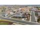 Aerial view of a well-maintained neighborhood with tree-lined streets close to community baseball fields at 6595 Meade Ct, Arvada, CO 80003