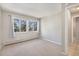 Bright bedroom with neutral walls, carpet, and a window providing plenty of natural light at 857 S Van Gordon Ct # G208, Lakewood, CO 80228