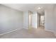 Bedroom with neutral carpet, light gray walls, and access to the bathroom, creating a comfortable space at 857 S Van Gordon Ct # G208, Lakewood, CO 80228