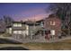 Charming multi-Gathering home with brick accents and well-maintained landscaping at dusk at 857 S Van Gordon Ct # G208, Lakewood, CO 80228