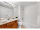 Bathroom featuring sink, toilet, and tub with shower at 5726 N Genoa Way # 204, Aurora, CO 80019
