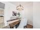 Cozy dining room features a wooden table with gray velvet chairs at 5726 N Genoa Way # 204, Aurora, CO 80019