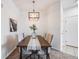 Cozy dining room with wood table and views of other rooms at 5726 N Genoa Way # 204, Aurora, CO 80019