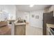 Kitchen area featuring stainless sink and barstool seating at 5726 N Genoa Way # 204, Aurora, CO 80019
