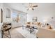 Living room view with modern fireplace and lots of natural light at 5726 N Genoa Way # 204, Aurora, CO 80019