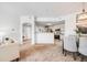 Open floor plan of living room leading to the kitchen at 5726 N Genoa Way # 204, Aurora, CO 80019