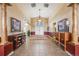Elegant lobby featuring neutral paint colors, wood trim, and tile flooring at 5726 N Genoa Way # 204, Aurora, CO 80019