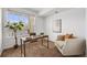 Bright office area with desk, chair, and ample natural light at 5726 N Genoa Way # 204, Aurora, CO 80019