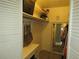 Walk-in closet with built-in shelving and mirror at 2325 S Linden Ct # 101, Denver, CO 80222