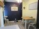 Dining area with table, chairs, and stylish wall decor at 2325 S Linden Ct # 101, Denver, CO 80222