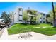 Well-maintained condominium complex with lush landscaping and mature trees at 2325 S Linden Ct # 101, Denver, CO 80222