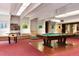 Recreational room featuring a pool table, foosball table, and comfortable seating at 2325 S Linden Ct # 101, Denver, CO 80222