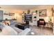 Inviting living room with an entertainment center, comfortable seating, and stylish decor at 2325 S Linden Ct # 101, Denver, CO 80222