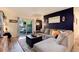 Cozy living room featuring a comfortable sectional sofa, stylish decor, and patio access at 2325 S Linden Ct # 101, Denver, CO 80222