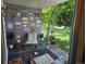 Cozy patio featuring comfortable seating, decorative wall art, and views of the lush green lawn at 2325 S Linden Ct # 101, Denver, CO 80222