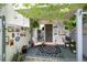 Inviting patio with cozy seating, decorative rug, and vibrant plants at 2325 S Linden Ct # 101, Denver, CO 80222