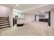 Finished basement with carpeted floors and a wet bar, perfect for entertaining at 3310 S Oneida Way, Denver, CO 80224