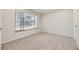 Bright bedroom with large window, neutral carpet and fresh paint at 3310 S Oneida Way, Denver, CO 80224