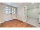 Open foyer featuring hardwood floors, a pair of French doors and a view to the carpeted living space at 3310 S Oneida Way, Denver, CO 80224