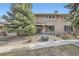 Charming brick townhouse with a well-manicured yard and inviting front entrance at 3310 S Oneida Way, Denver, CO 80224