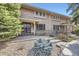 Attractive townhouse exterior with a welcoming entrance, ramp, and professionally landscaped yard at 3310 S Oneida Way, Denver, CO 80224