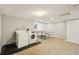 Finished basement area featuring a washer, dryer, ping pong table, and durable flooring at 2408 Concord Cir, Lafayette, CO 80026
