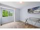 Light-filled bedroom with a large window, soft carpeting, and a modern glass desk at 2408 Concord Cir, Lafayette, CO 80026