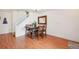 Cozy dining area with hardwood floors, staircase, and lovely decor at 2408 Concord Cir, Lafayette, CO 80026
