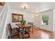 Charming dining area features a stylish wood table set and an attractive mirror accent at 2408 Concord Cir, Lafayette, CO 80026