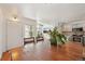Bright dining area showcasing a wooden table, hardwood floors, and easy access to the kitchen at 2408 Concord Cir, Lafayette, CO 80026
