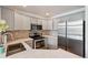Modern kitchen showcasing stainless steel appliances, stylish countertops, and ample cabinet space at 2408 Concord Cir, Lafayette, CO 80026