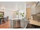 Bright, open kitchen with stainless steel appliances, light countertops, and tiled backsplash at 2408 Concord Cir, Lafayette, CO 80026