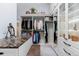 Walk-in closet with custom shelving, drawers, vanity, and ample storage space for organization at 689 Red Deer Rd, Franktown, CO 80116