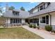 Charming exterior showcasing a well-maintained lawn, a stylish roof, and black framed windows at 689 Red Deer Rd, Franktown, CO 80116