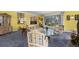 Open living room with large windows, hardwood floors, and stylish decor at 689 Red Deer Rd, Franktown, CO 80116