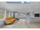 Spacious living room with skylights, hardwood floors, and lots of light at 689 Red Deer Rd, Franktown, CO 80116