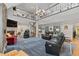 Inviting living room featuring vaulted ceilings, a fireplace, and a spiral staircase leading to the second floor at 689 Red Deer Rd, Franktown, CO 80116