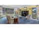Bright living room with large windows, fireplace, and carpeted floor at 689 Red Deer Rd, Franktown, CO 80116