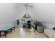 Bright home office with unique angled windows, providing ample light, and featuring light wood floors at 689 Red Deer Rd, Franktown, CO 80116