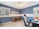 Comfortable bedroom with built-in shelving, carpeted floors, and natural light at 10247 Telluride Way, Commerce City, CO 80022