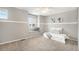 Calm bedroom with carpet, a cushioned window seat, and neutral wall colors at 10247 Telluride Way, Commerce City, CO 80022